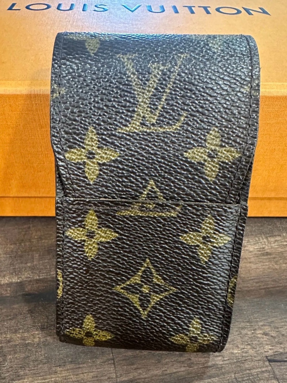 Louis Vuitton Etui Cigarette case crafted in the iconic monogram coated canvas.